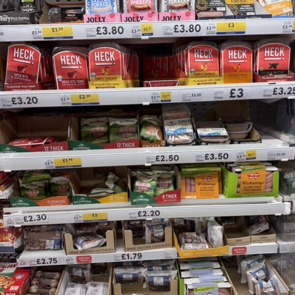 A supermarket shelf full of sausages.