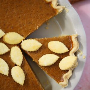 Close up overhead shot of a slice of gluten free pumpkin pie.