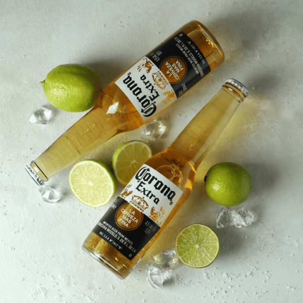 corona beer bottles with lime wedges