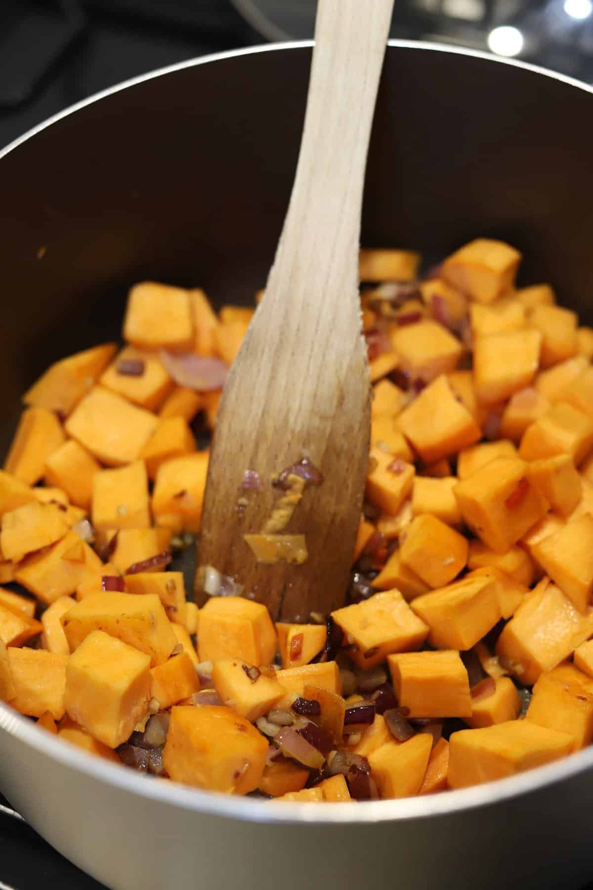 Sweet Potato Chilli and Coconut Soup - adding the sweet potato and frying 