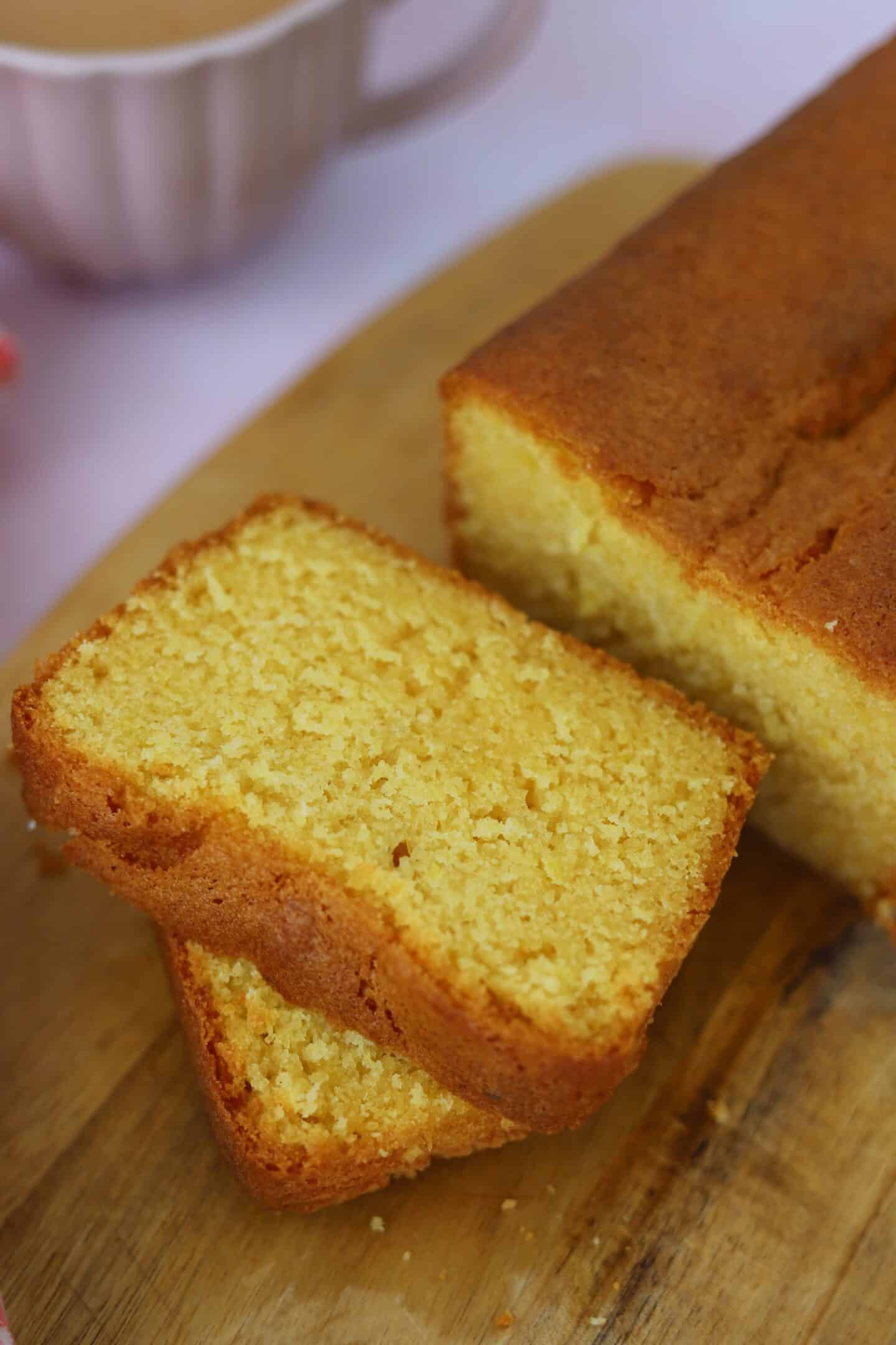 Slices of gluten free Madeira cake on a chopping board.