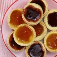 A plate of gluten free jam tarts.