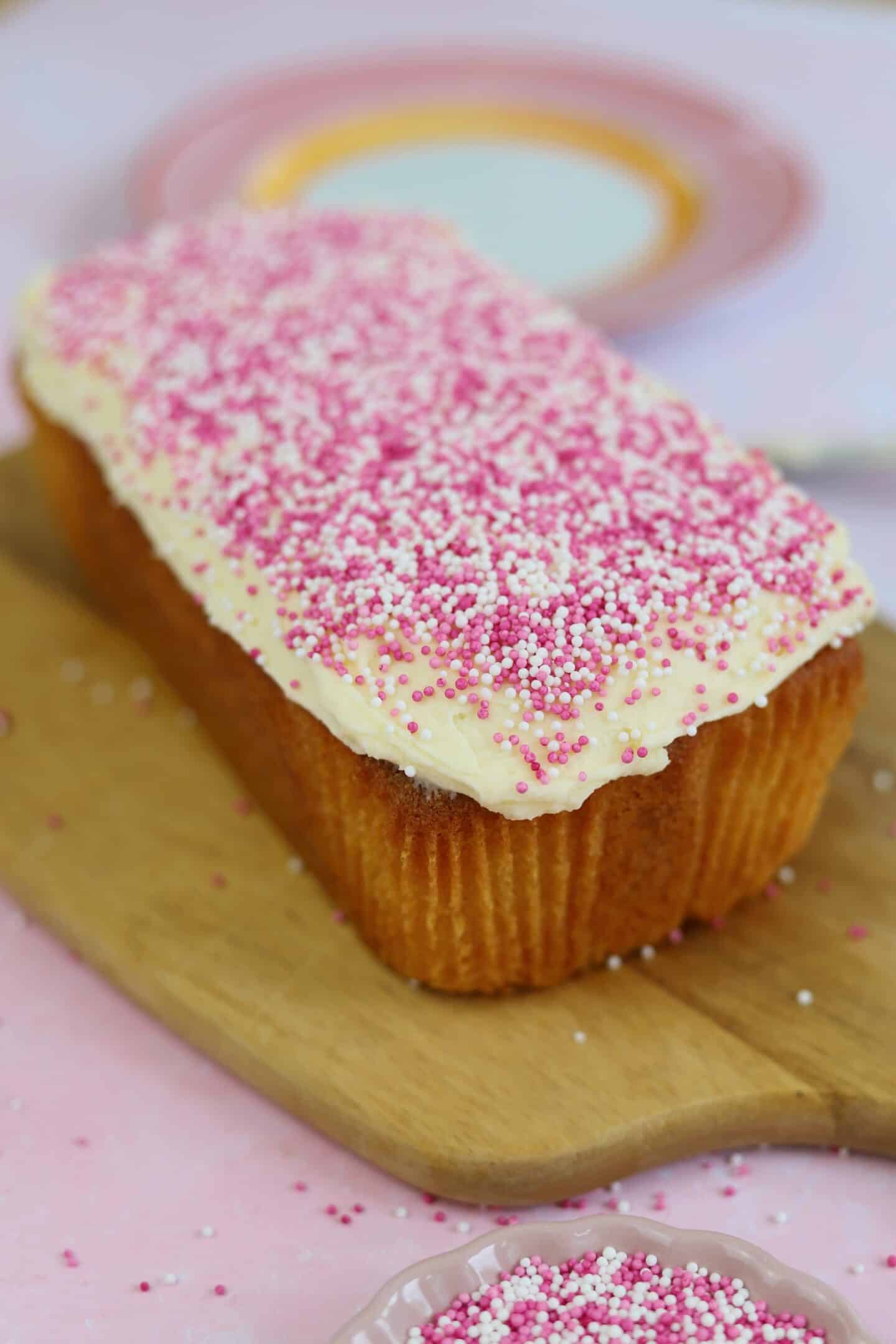 A vanilla loaf cake on a chopping board.