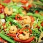 King Prawn noodle stir fry in a wok.