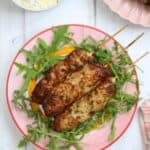 Lean pork koftas on a plate with salad.