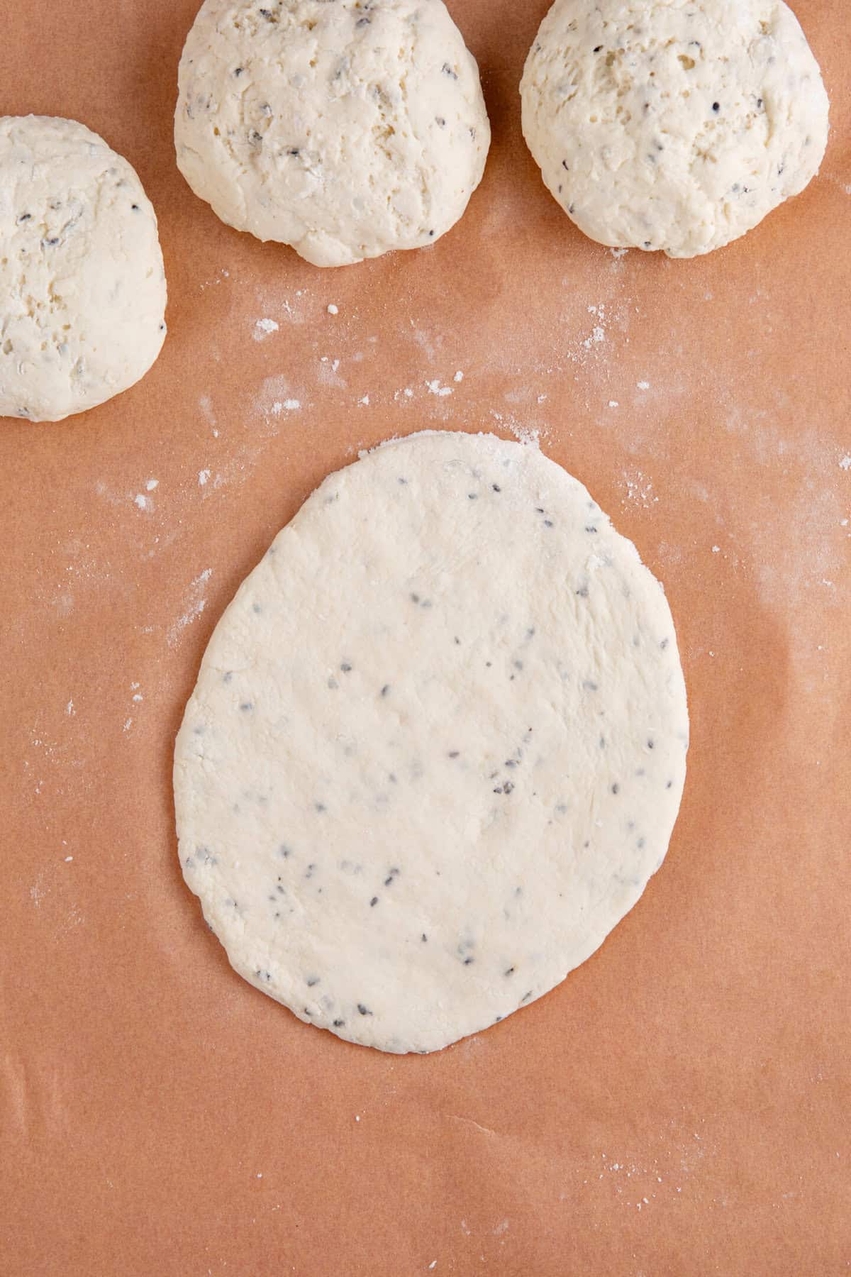 Process shot for gluten free naan bread recipe showing the dough shaped into a naan.