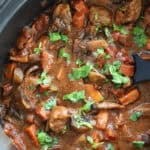 Beef and chorizo stew in the slow cooker pan.