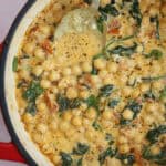 Close up of a pan of Marry Me Chickpeas in a creamy Tuscan sauce.