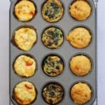 A muffin tin filled with gluten free egg muffins on a cooling rack.