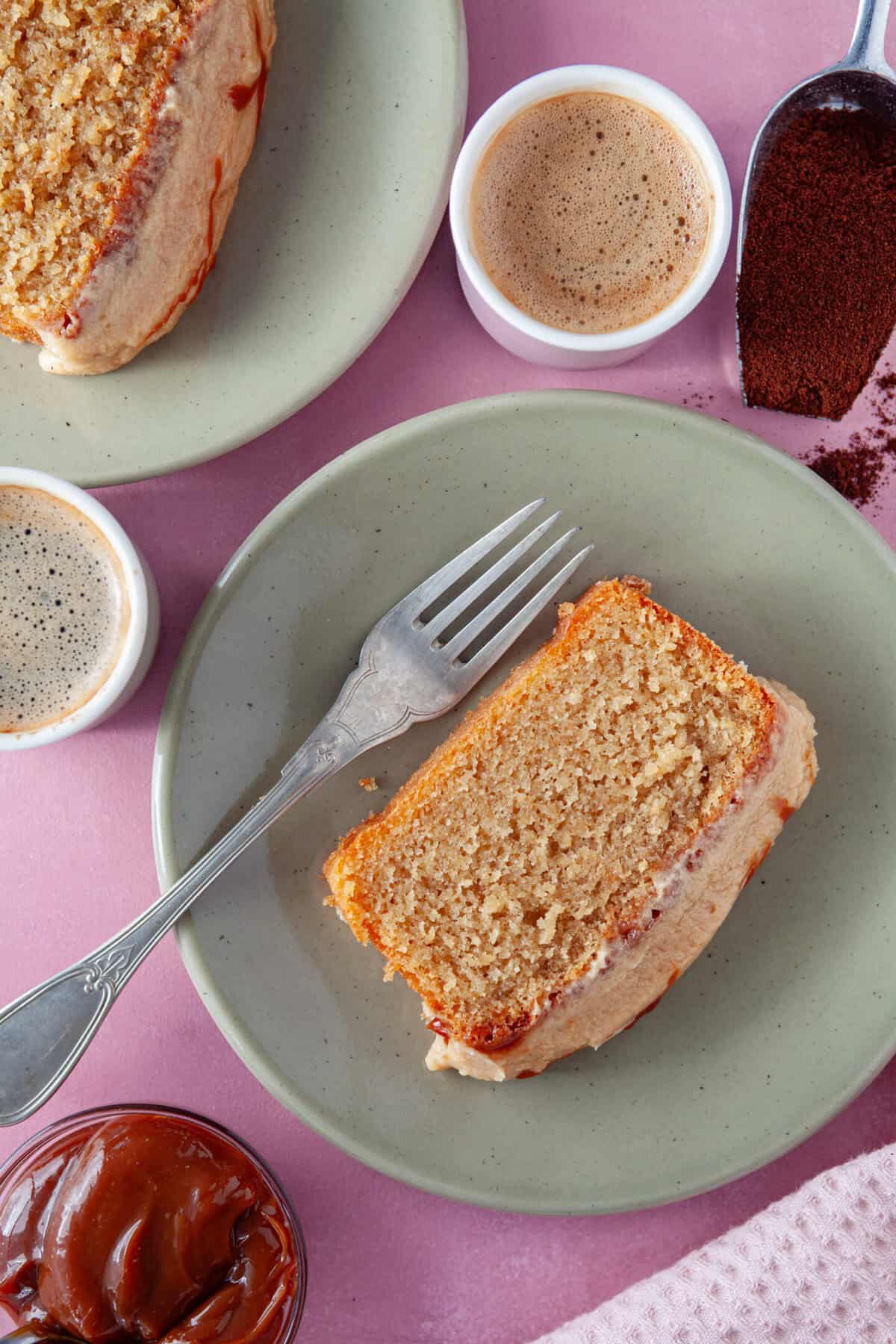 A slice of caramel latte cake on a plate.