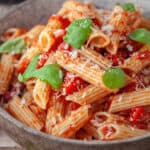 Close up of a bowl of penne arrabbiata.