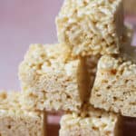 Gluten free rice krispies squares stacked on top of each other.