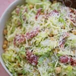 Close up of a la scala chopped salad with lettuce, mozzarella and salami.