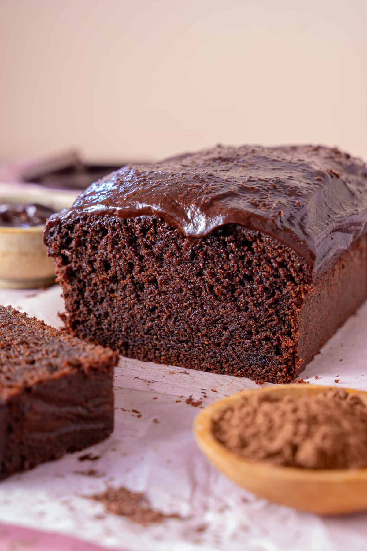 Cross section of a chocolate coffee cake with a slice taken off.
