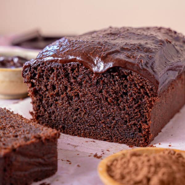 Cross section of a chocolate coffee cake with a slice taken off.
