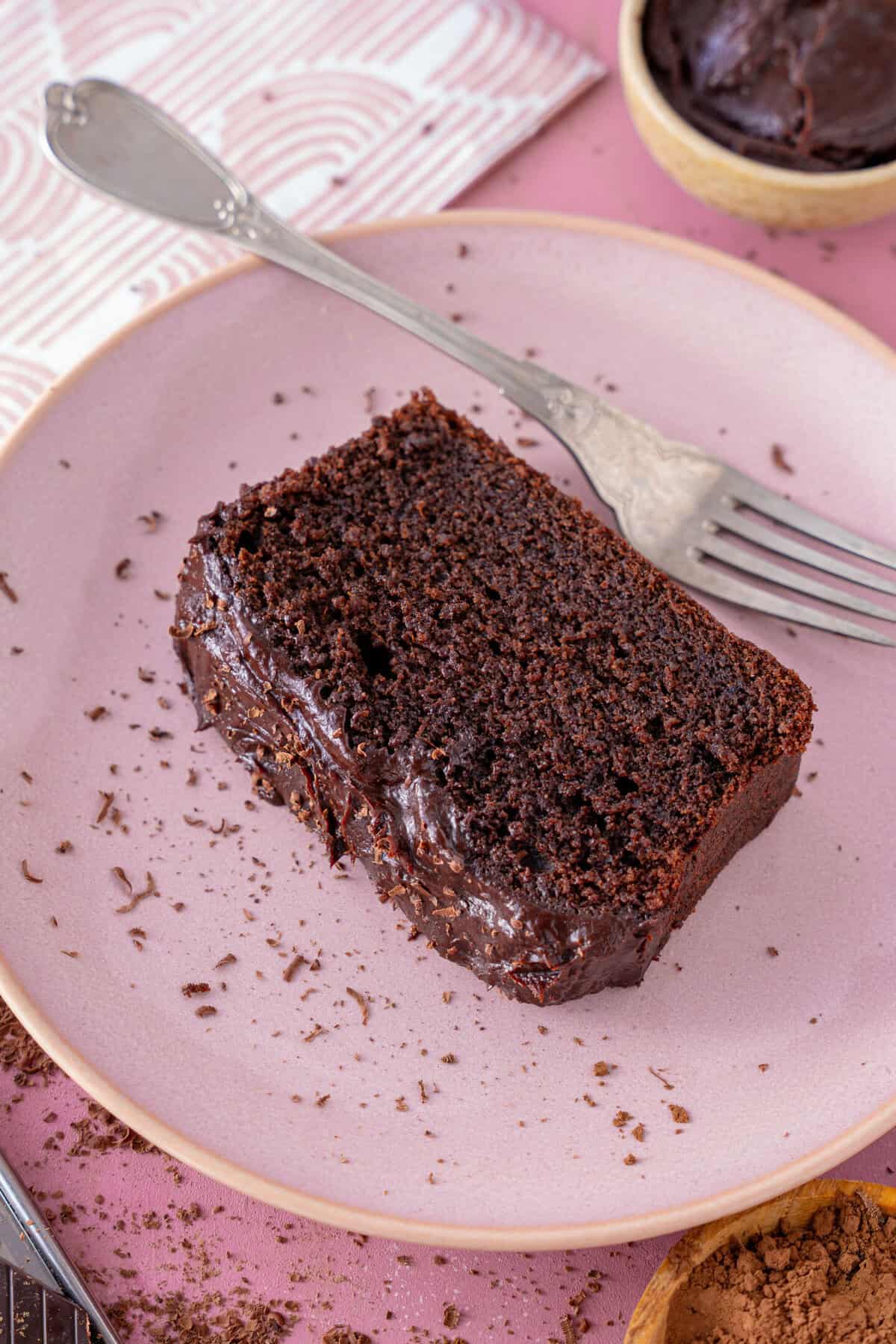 A slice of chocolate coffee cake on a plate.