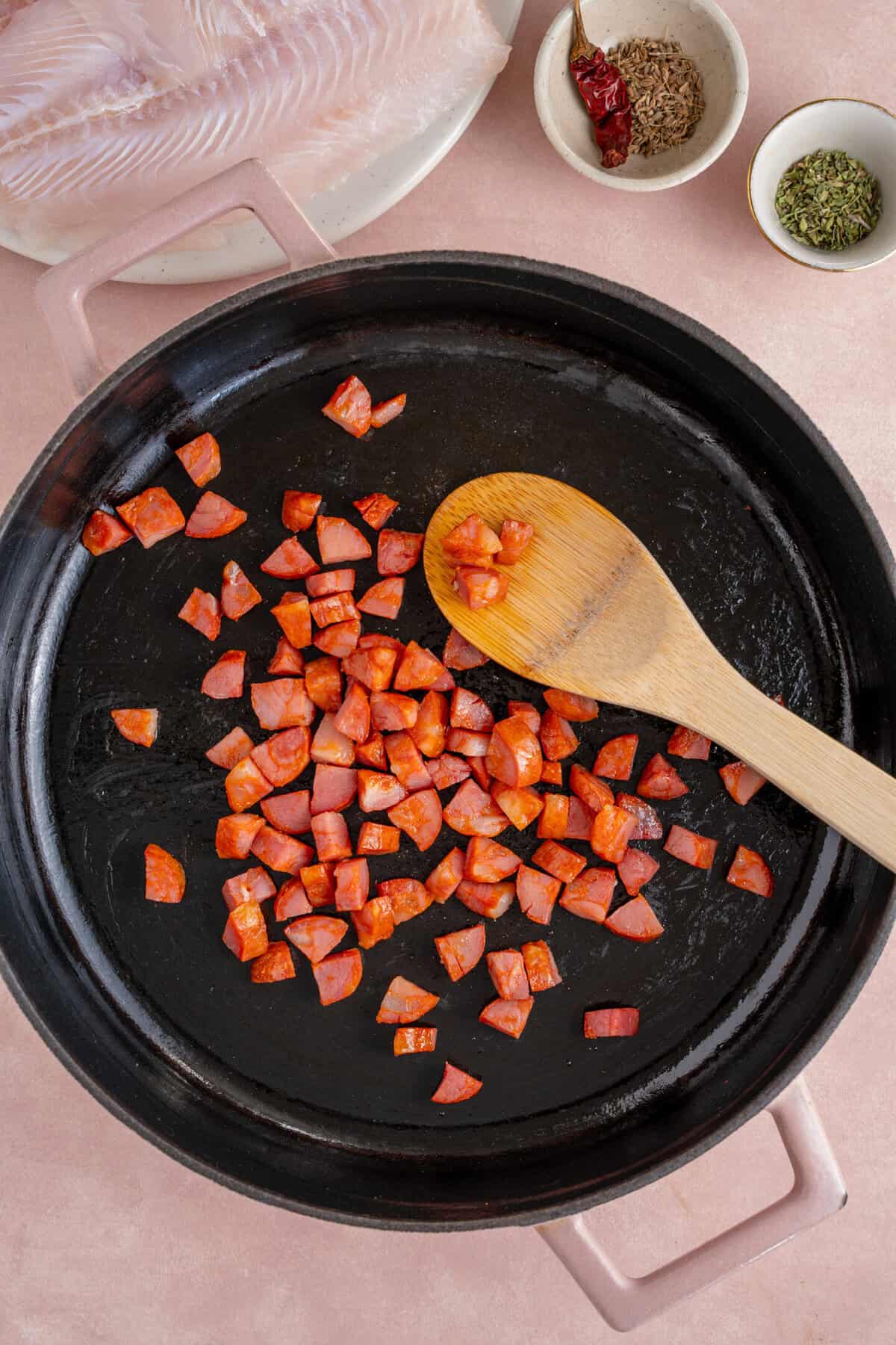Frying the chorizo in a pan.