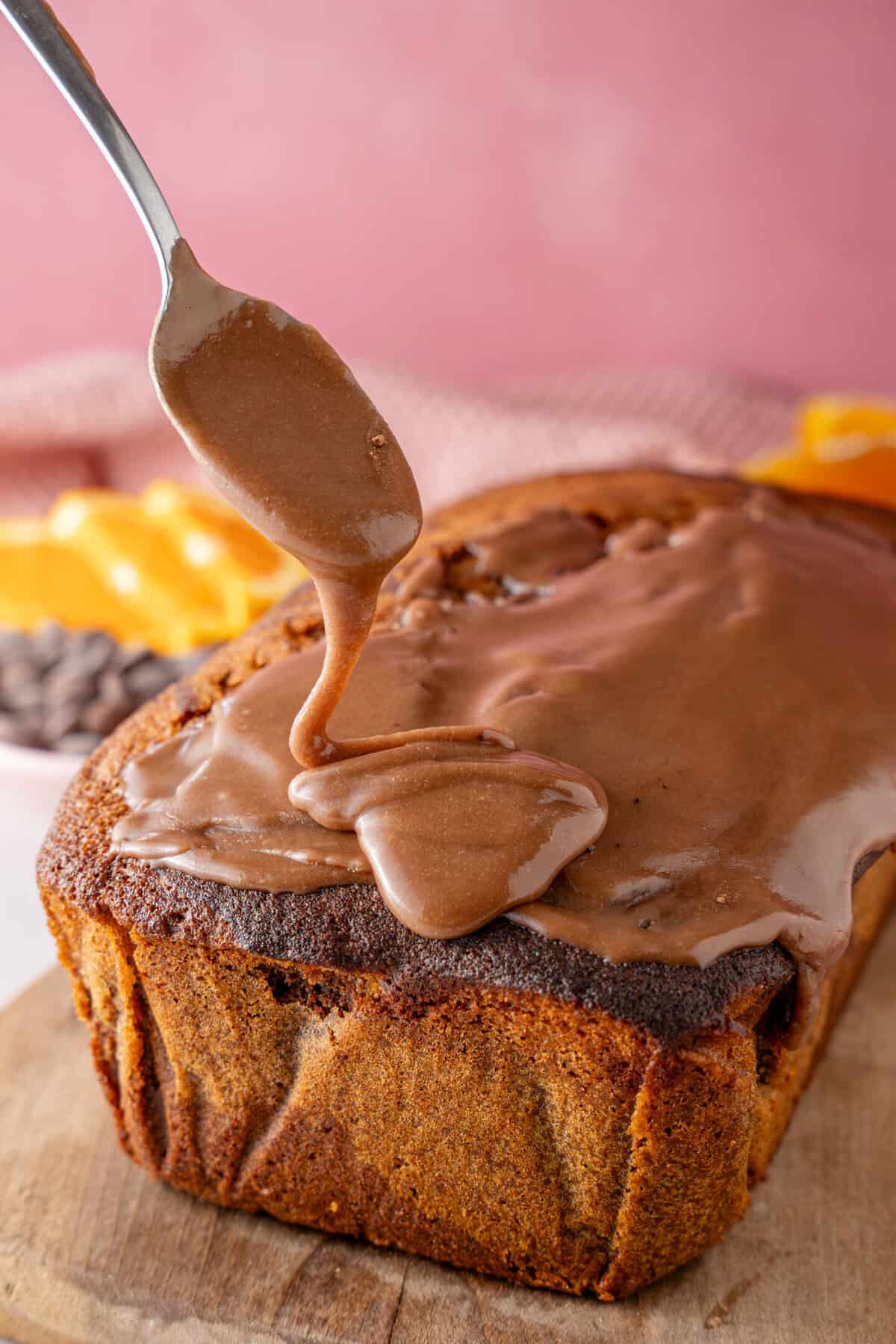 Decorating the cake with the chocolate orange frosting.
