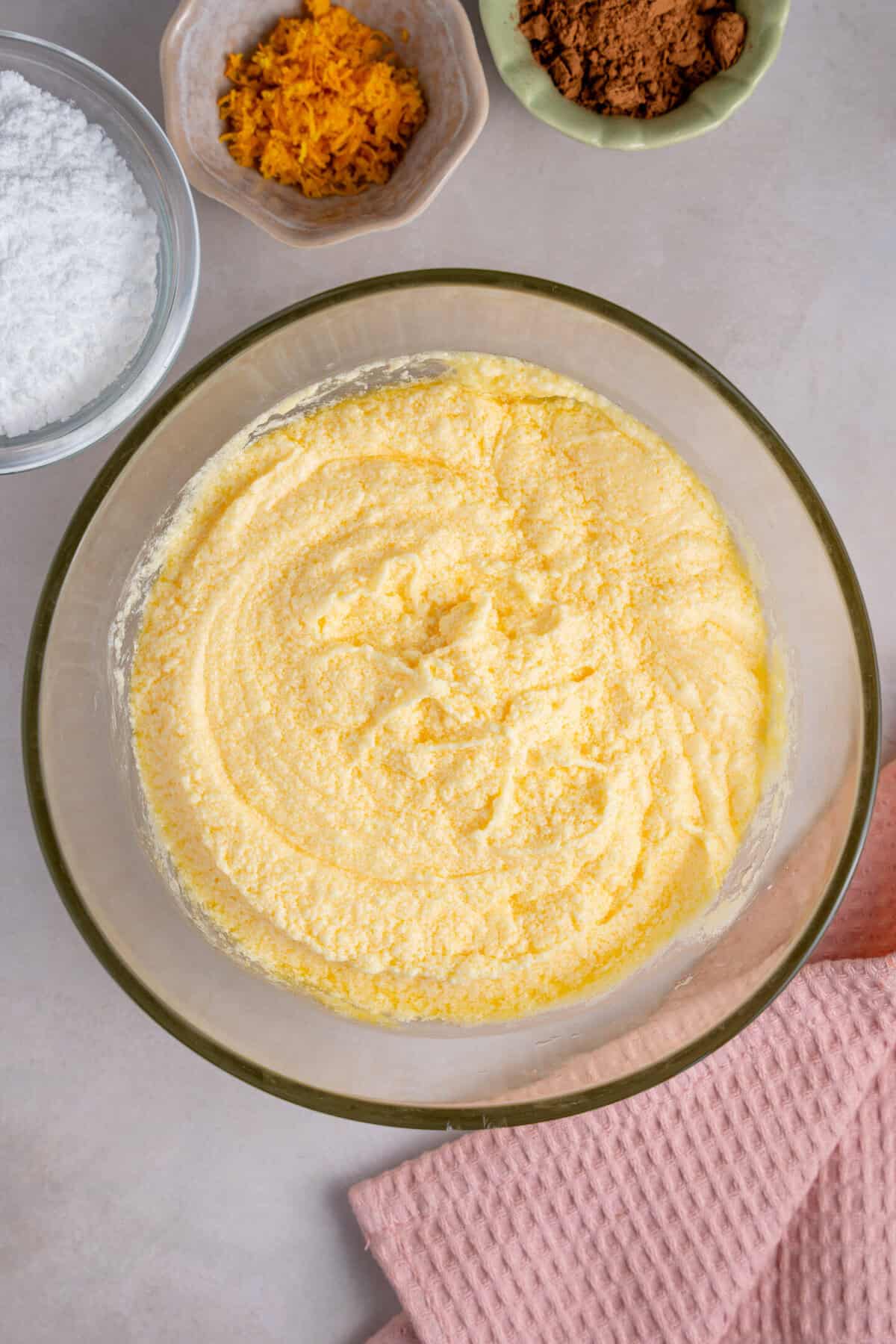 A bowl with the wet ingredients for cake mixed together.