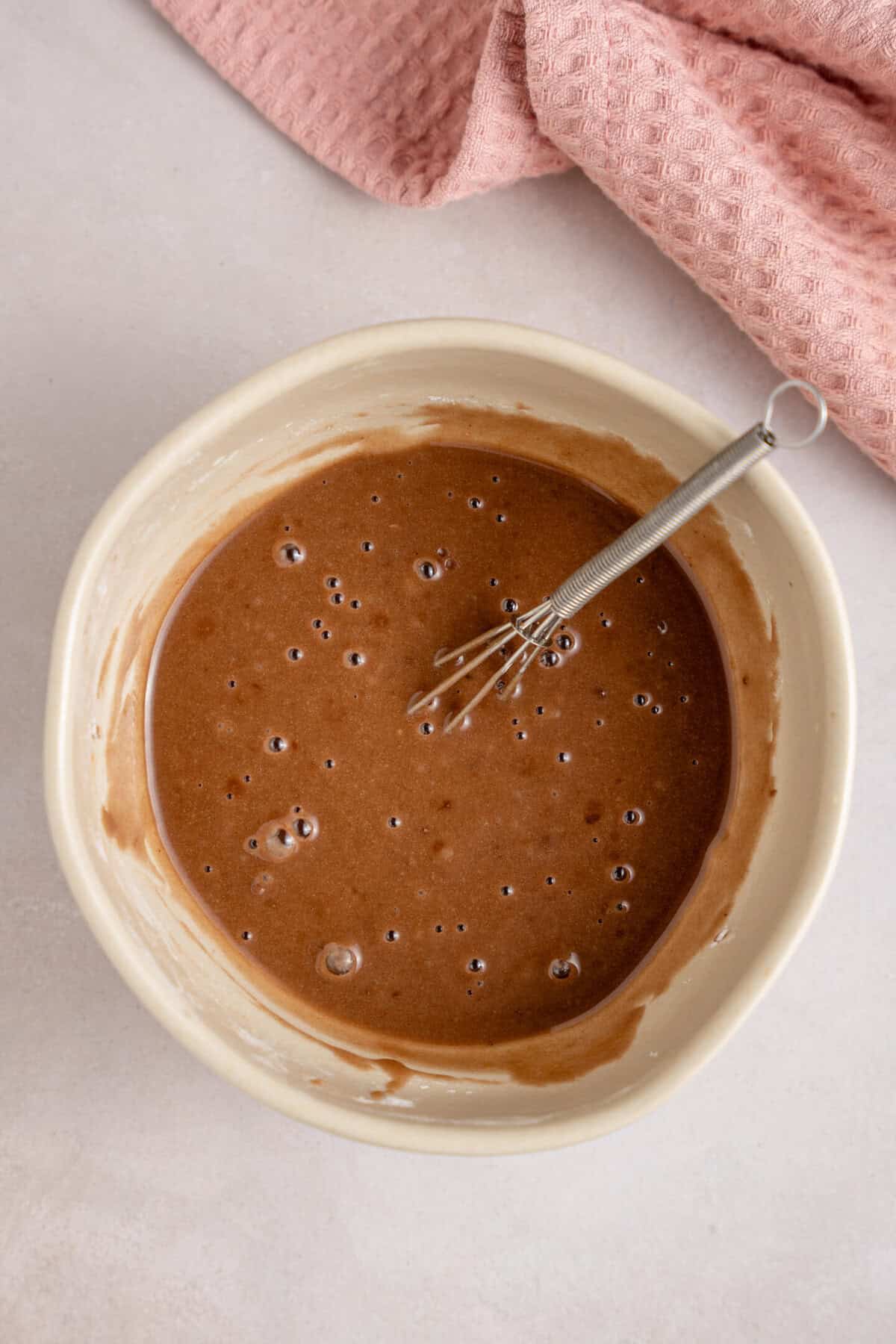 Mixing together the chocolate orange frosting.