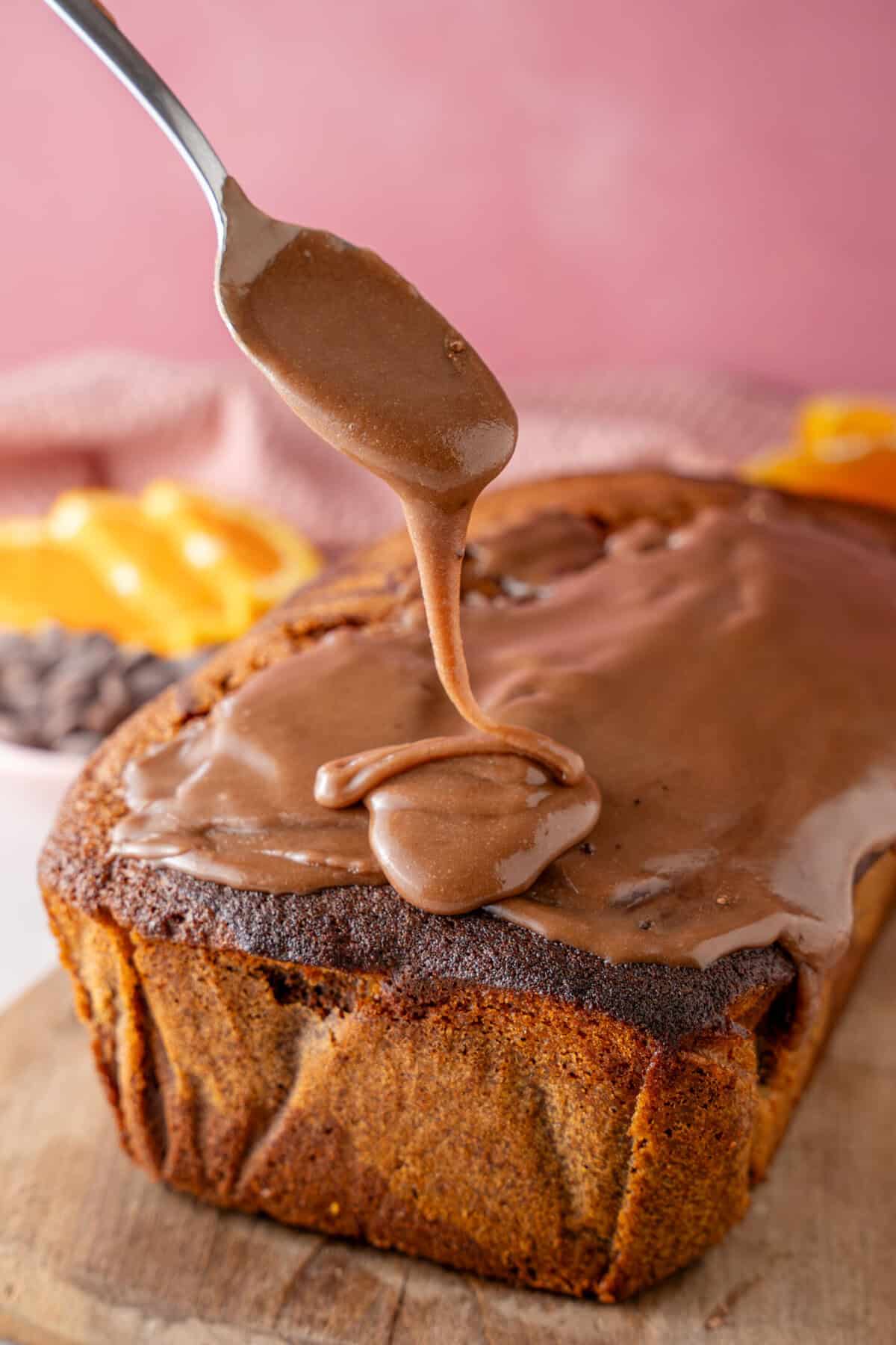 Decorating the cake with the chocolate orange frosting.