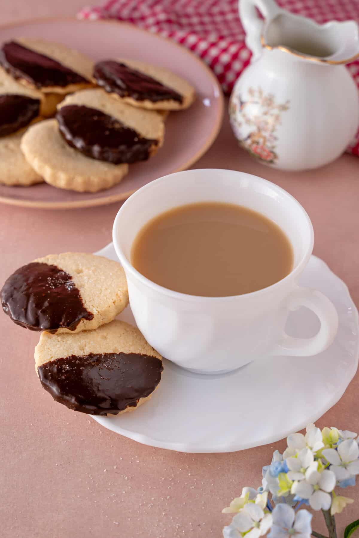 Chocolate-dipped shortbread with a cup of tea.
