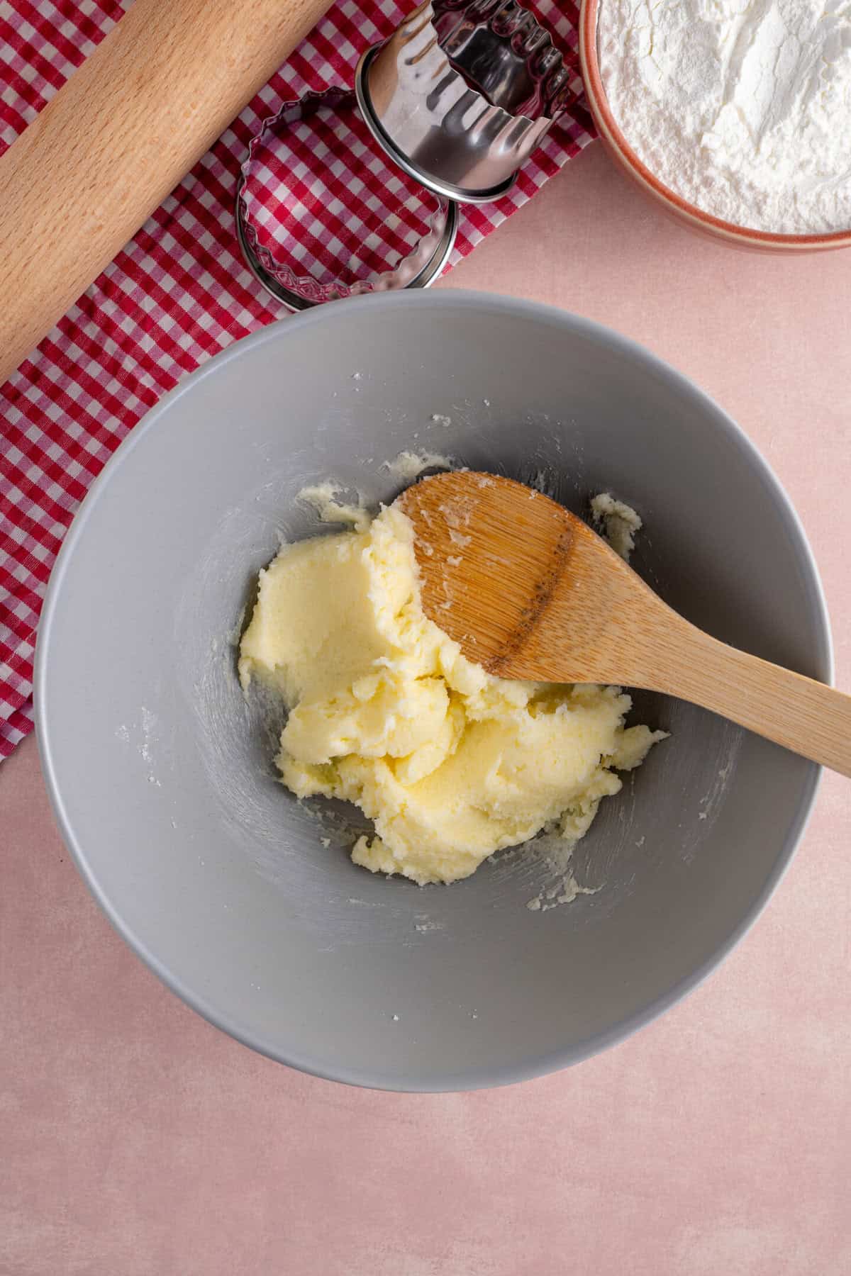 The butter and sugar in a bowl, creamed together.