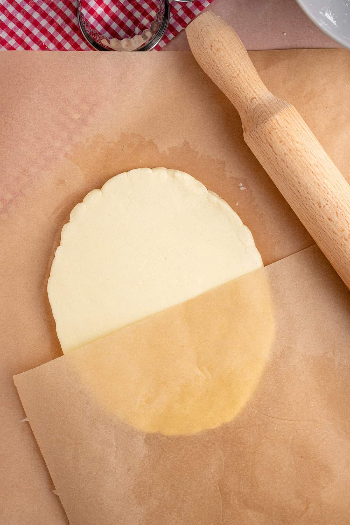 Roll the shortbread dough between two sheets of baking paper.
