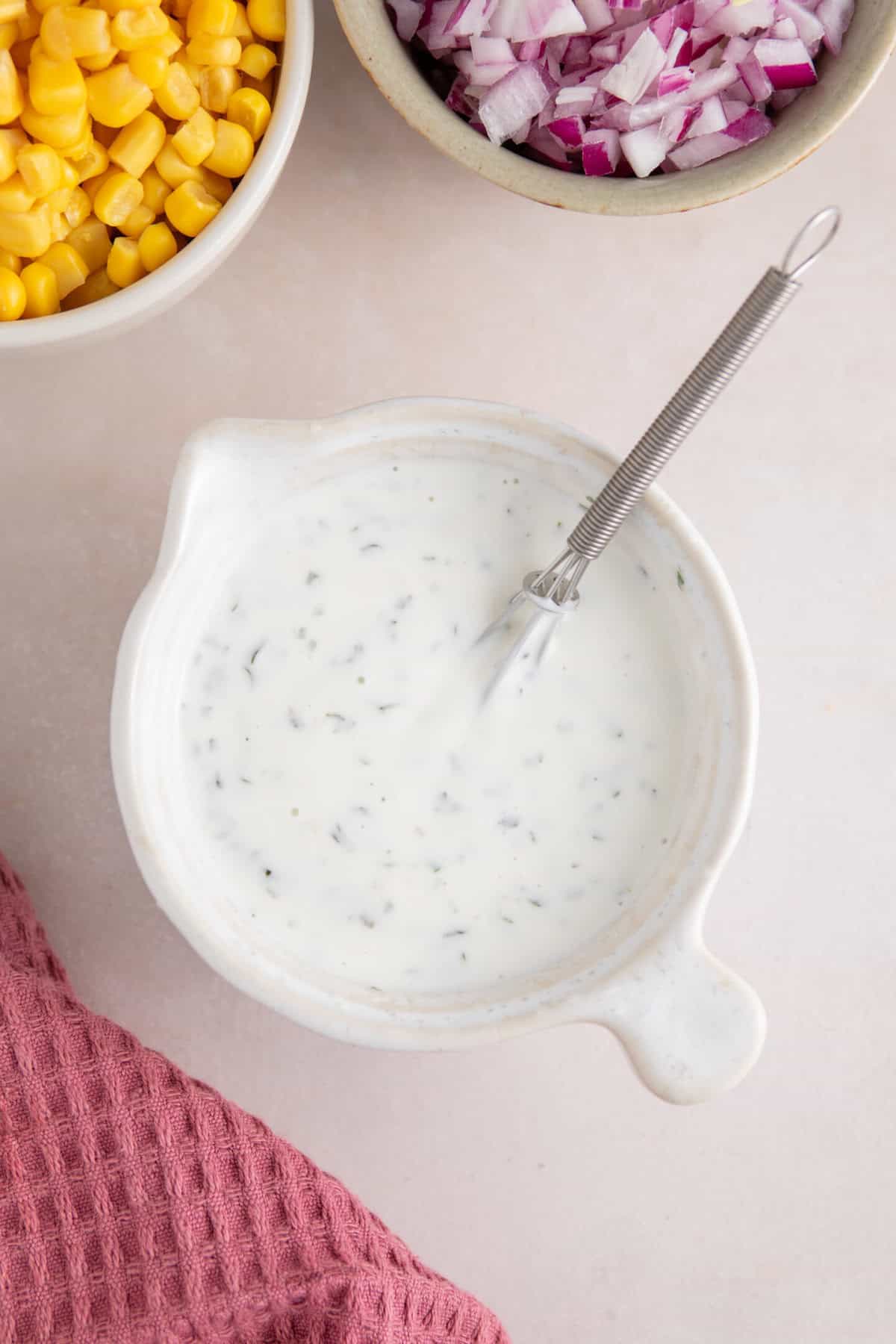 A bowl of homemade ranch dressing.
