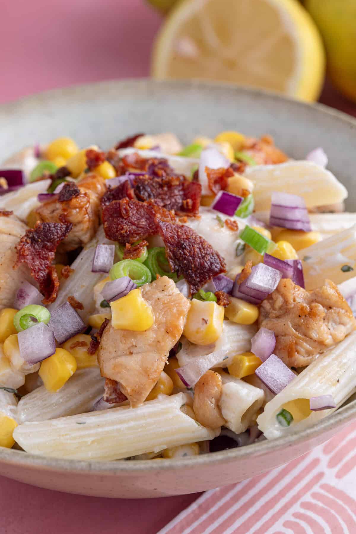A bowl of gluten free chicken and bacon pasta salad.