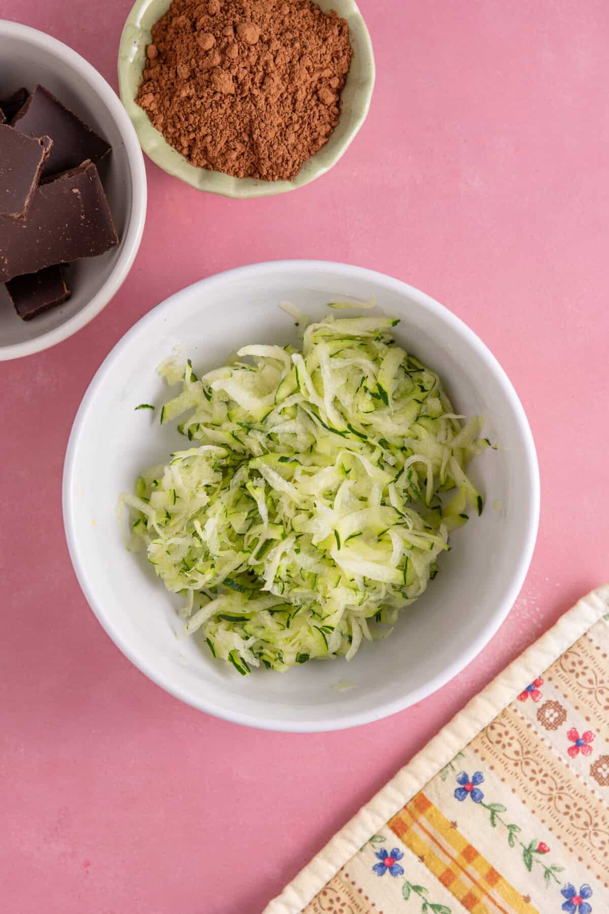 A bowl of grated courgette.