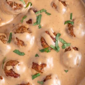 Close up of a pan of Ikea meatballs in homemade gravy.