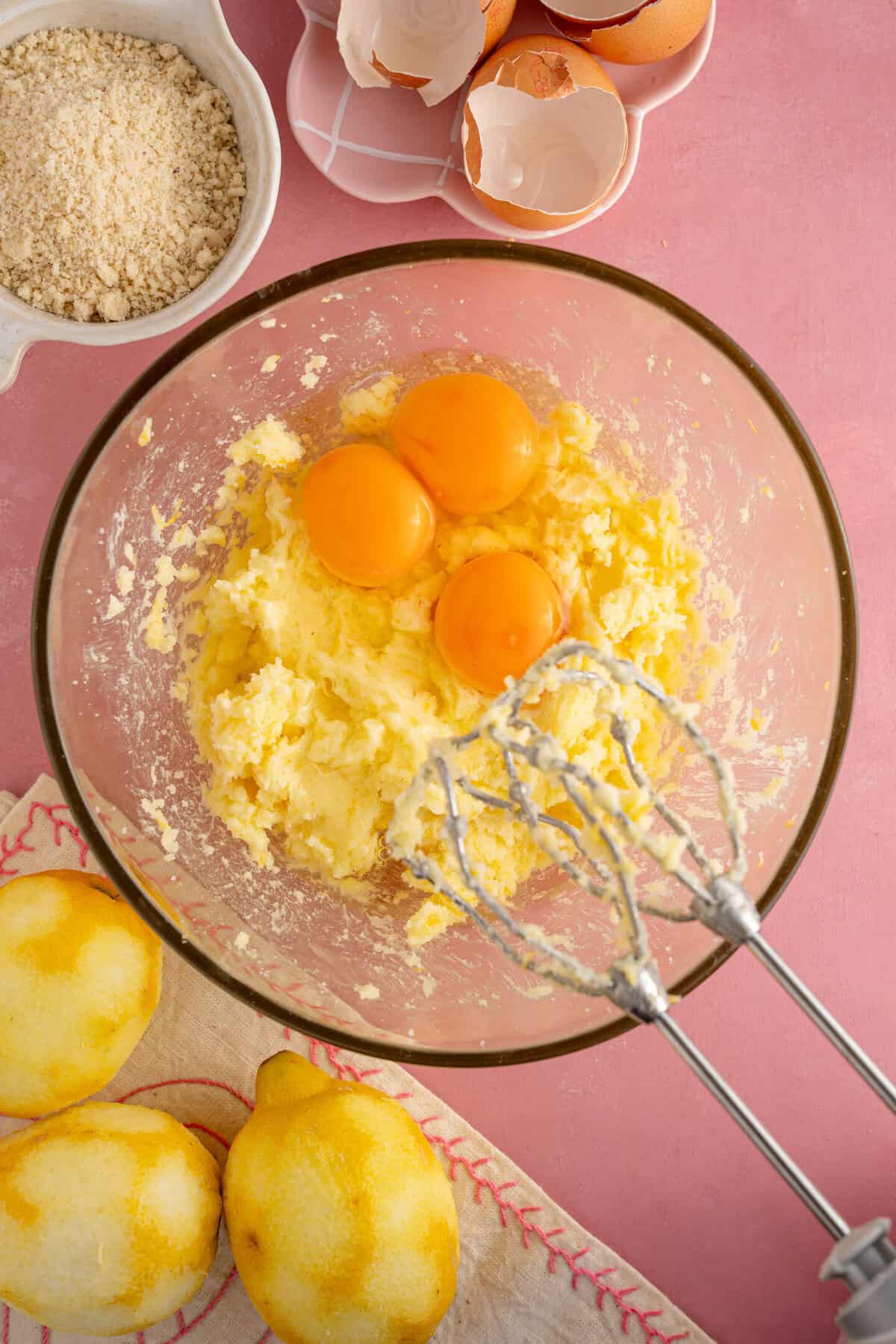 Add the eggs into the butter and sugar mixture.