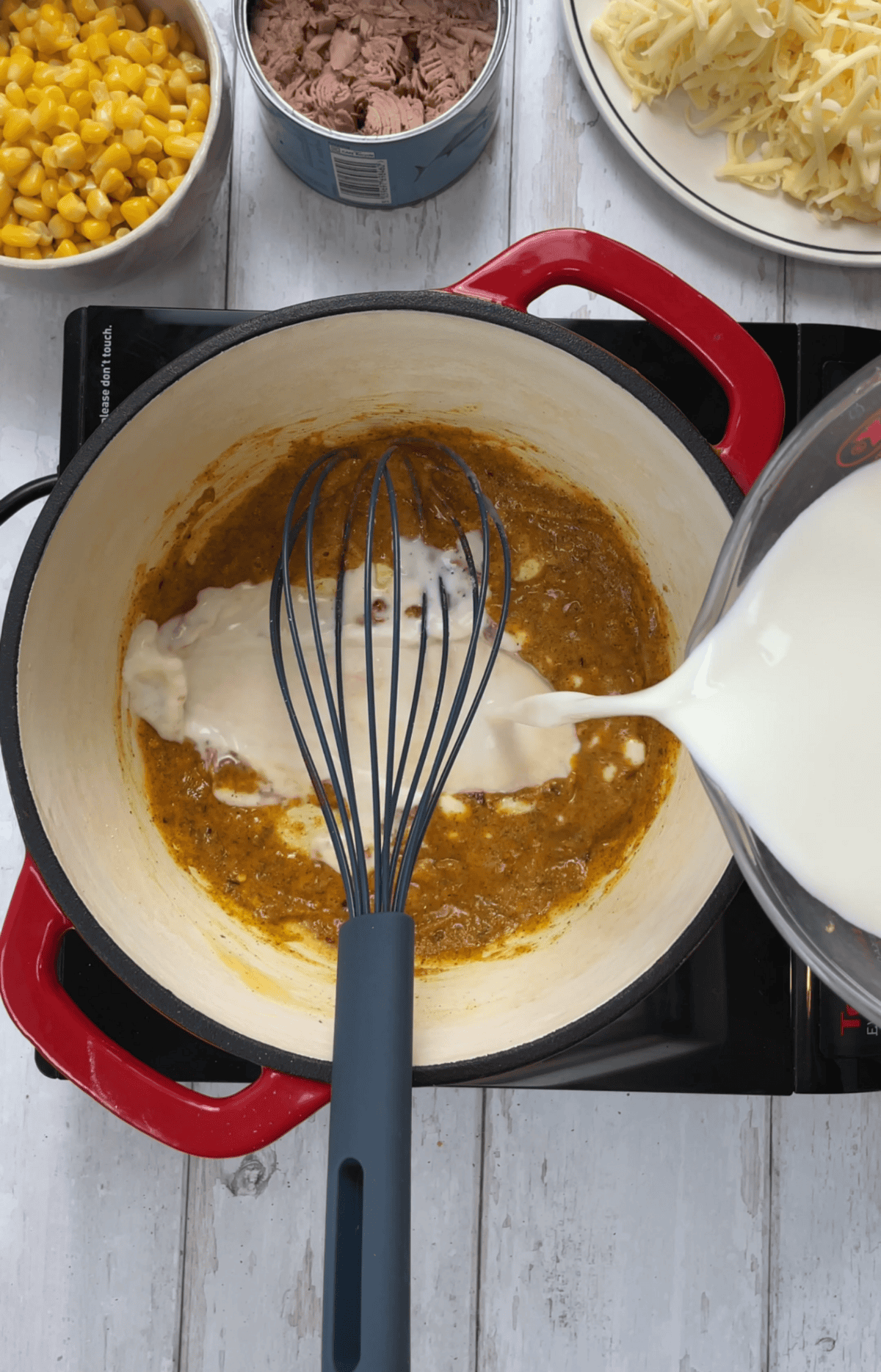 Mix in the spices then gradually add the milk to form a smooth sauce.