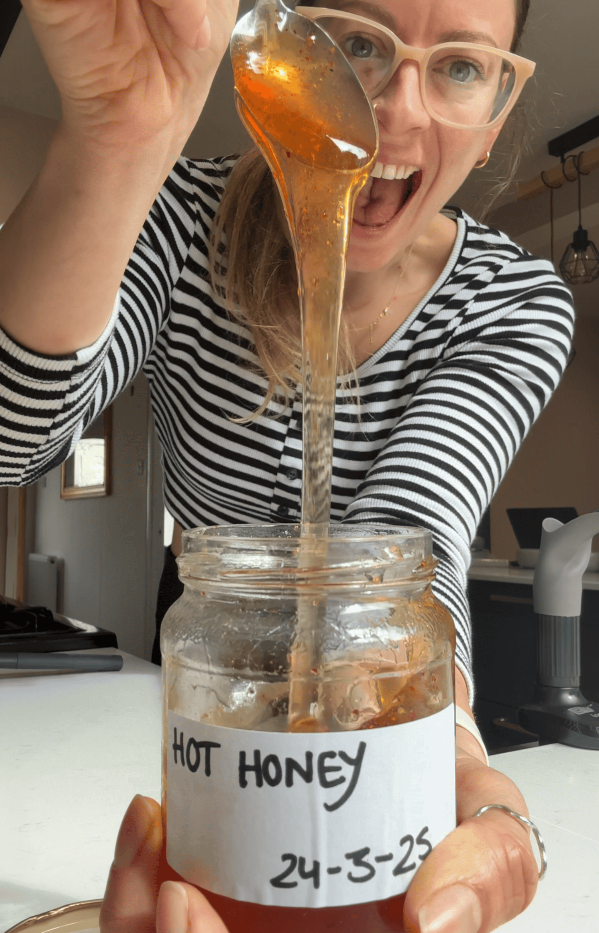 Author Sarah Howells with a jar of hot honey.