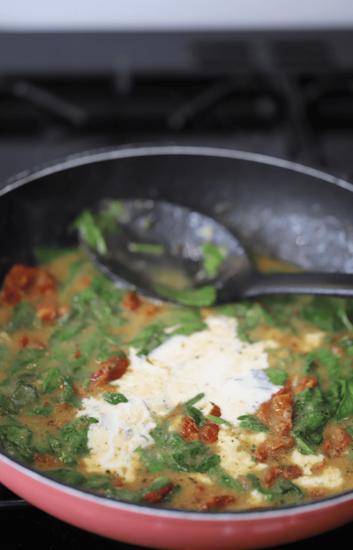 Add the spinach and cream to finish the sauce.