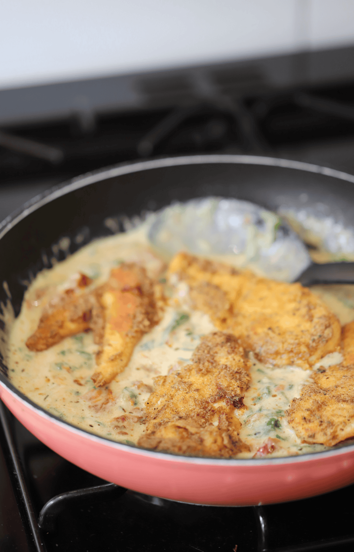 Add the fried chicken back into the pan to serve.