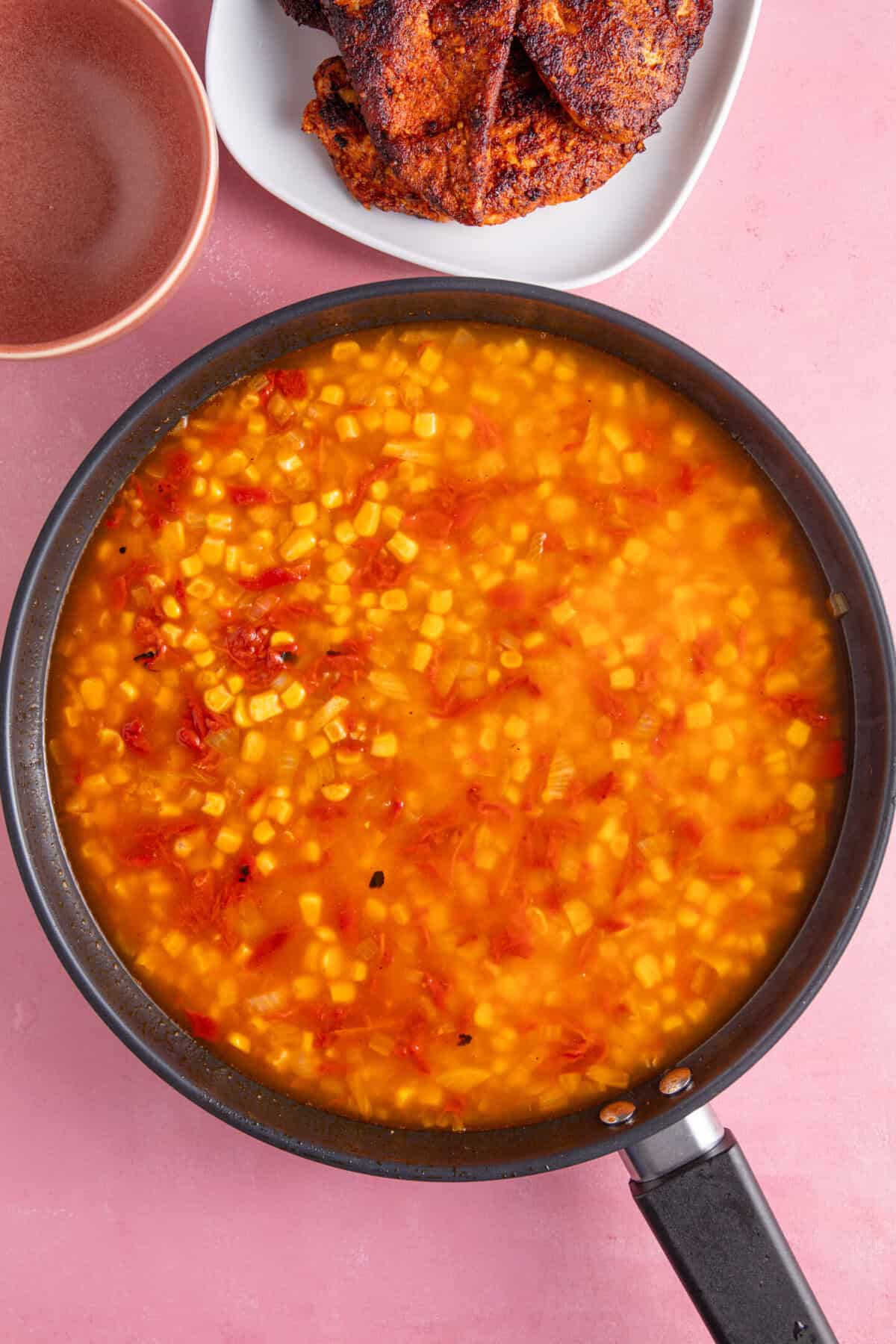 A pan of rice and veg with stock.