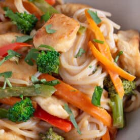 Close up of a bowl of peanut butter noodles.