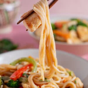 Chopsticks with peanut butter noodles.