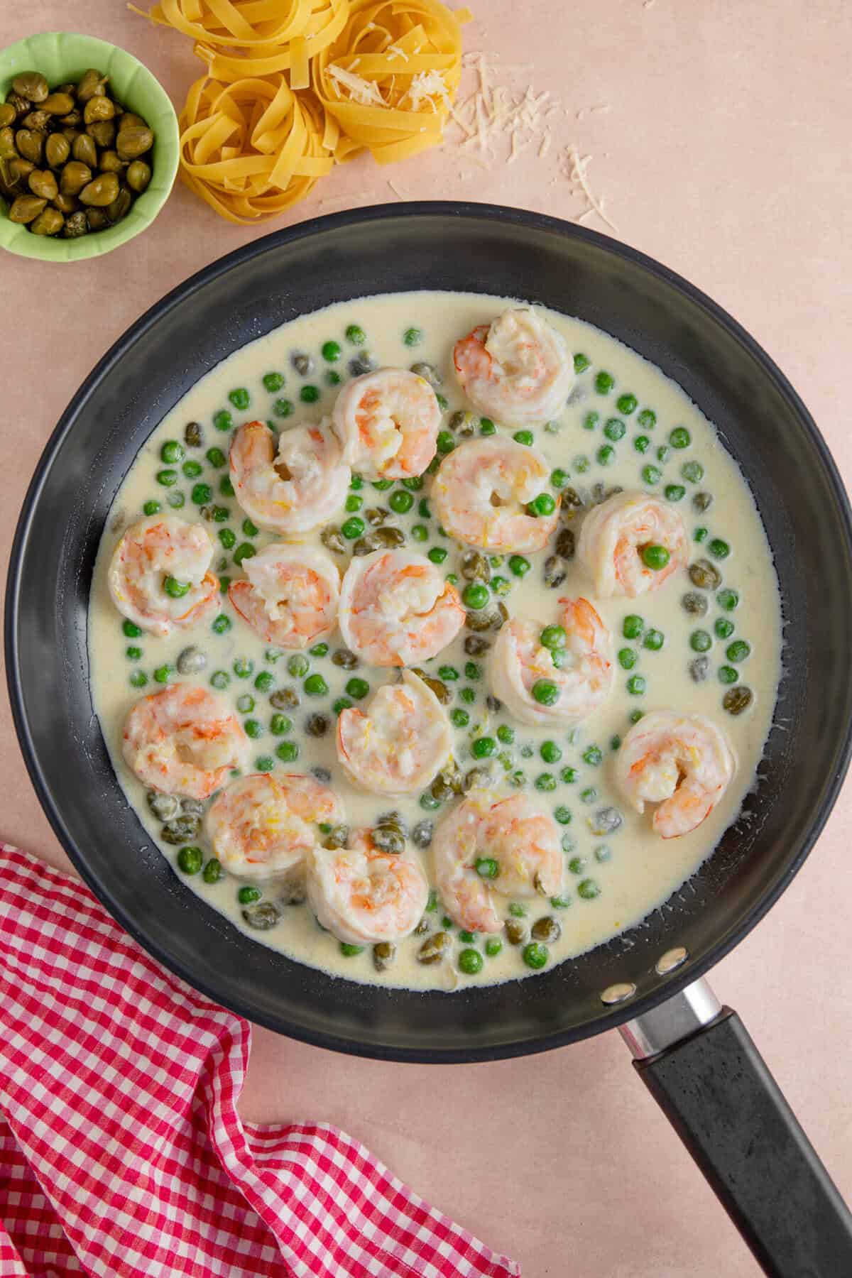 Add the double cream to the pan and reduce the sauce.