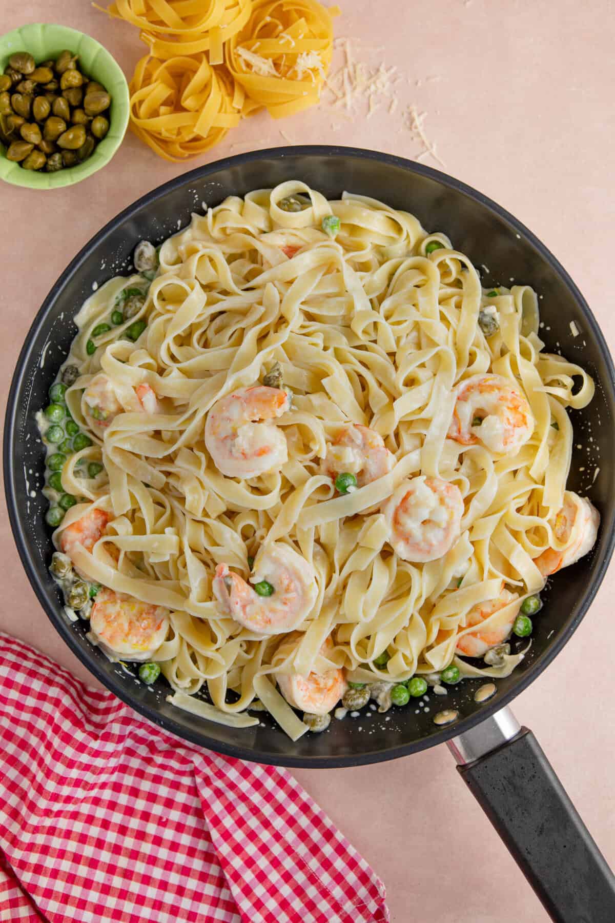 Stir the gluten free pasta into the prawns and sauce.