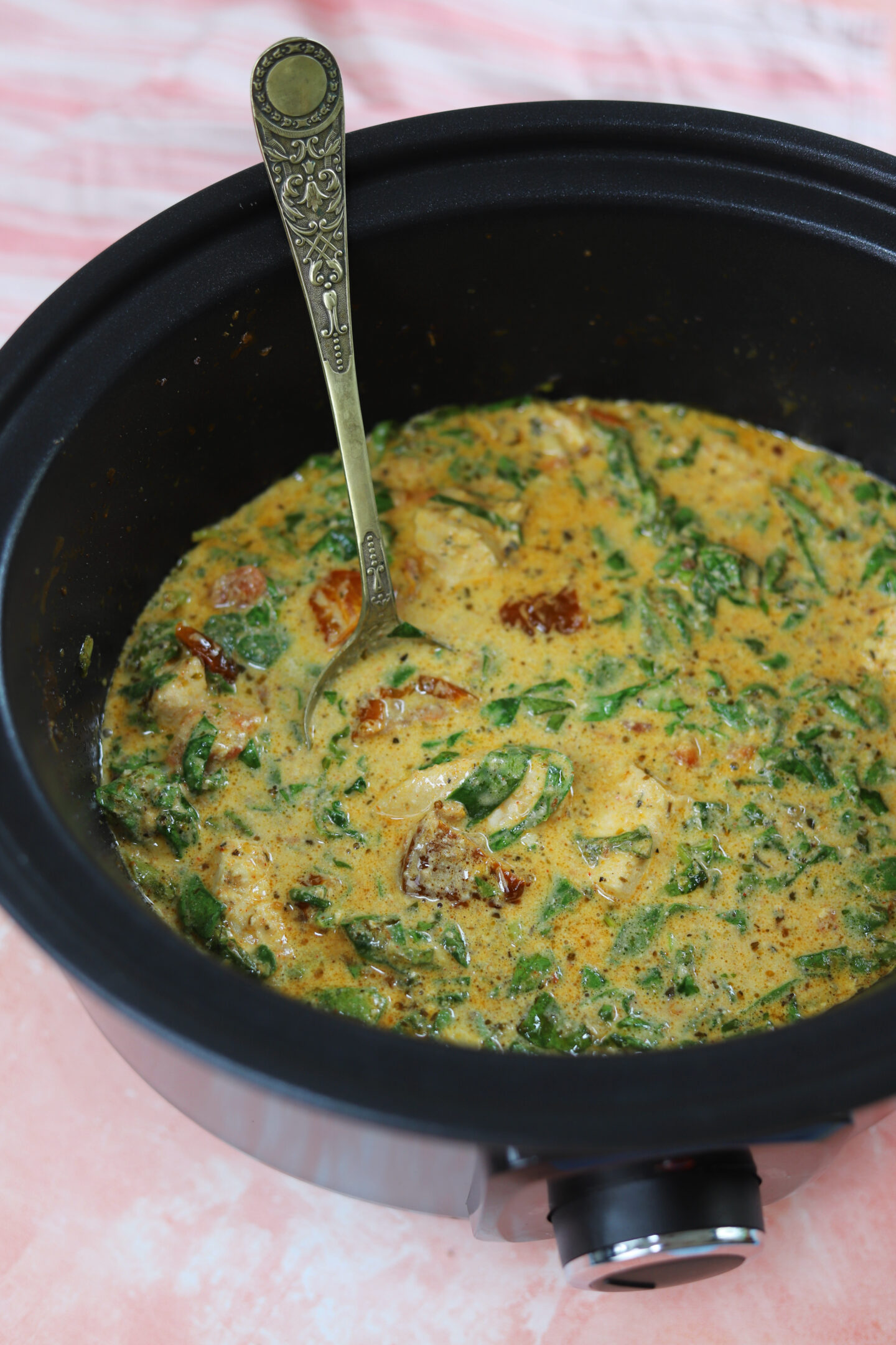 Slow cooker tuscan chicken in a crockpot.