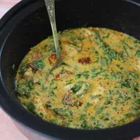 Slow cooker tuscan chicken in a crockpot.