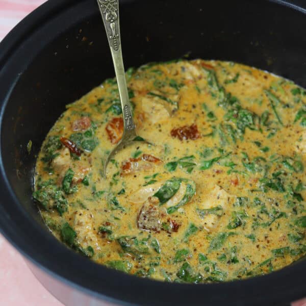 Slow cooker tuscan chicken in a crockpot.