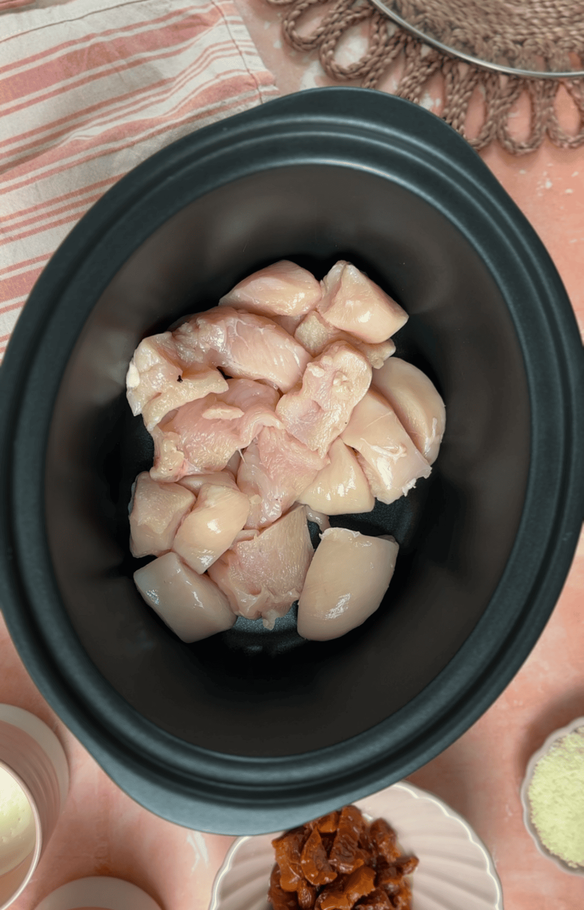 Add the chicken to the slow cooker.