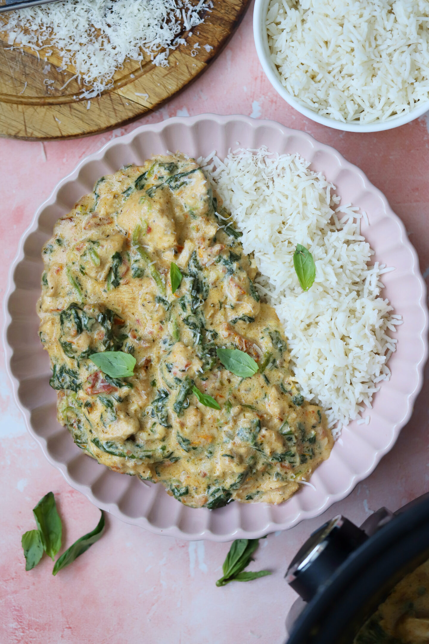 A bowl of gluten free tuscan chicken and rice.