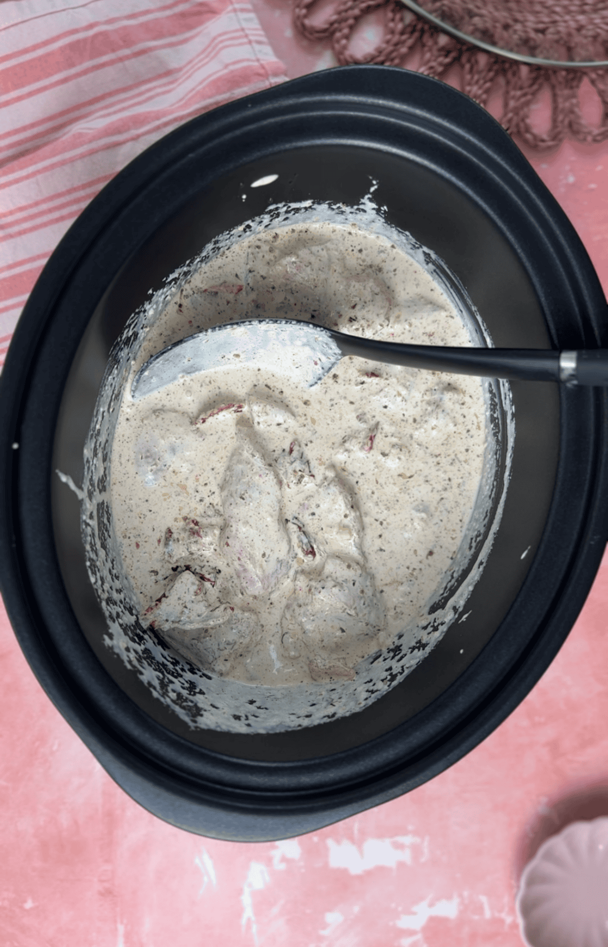 Add the cream to the slow cooker then cook.