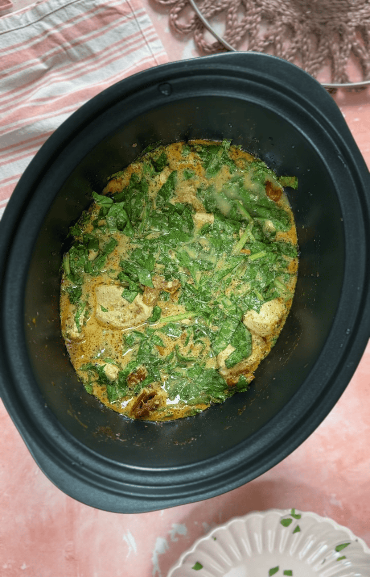Stir the spinach into the Tuscan chicken before serving.