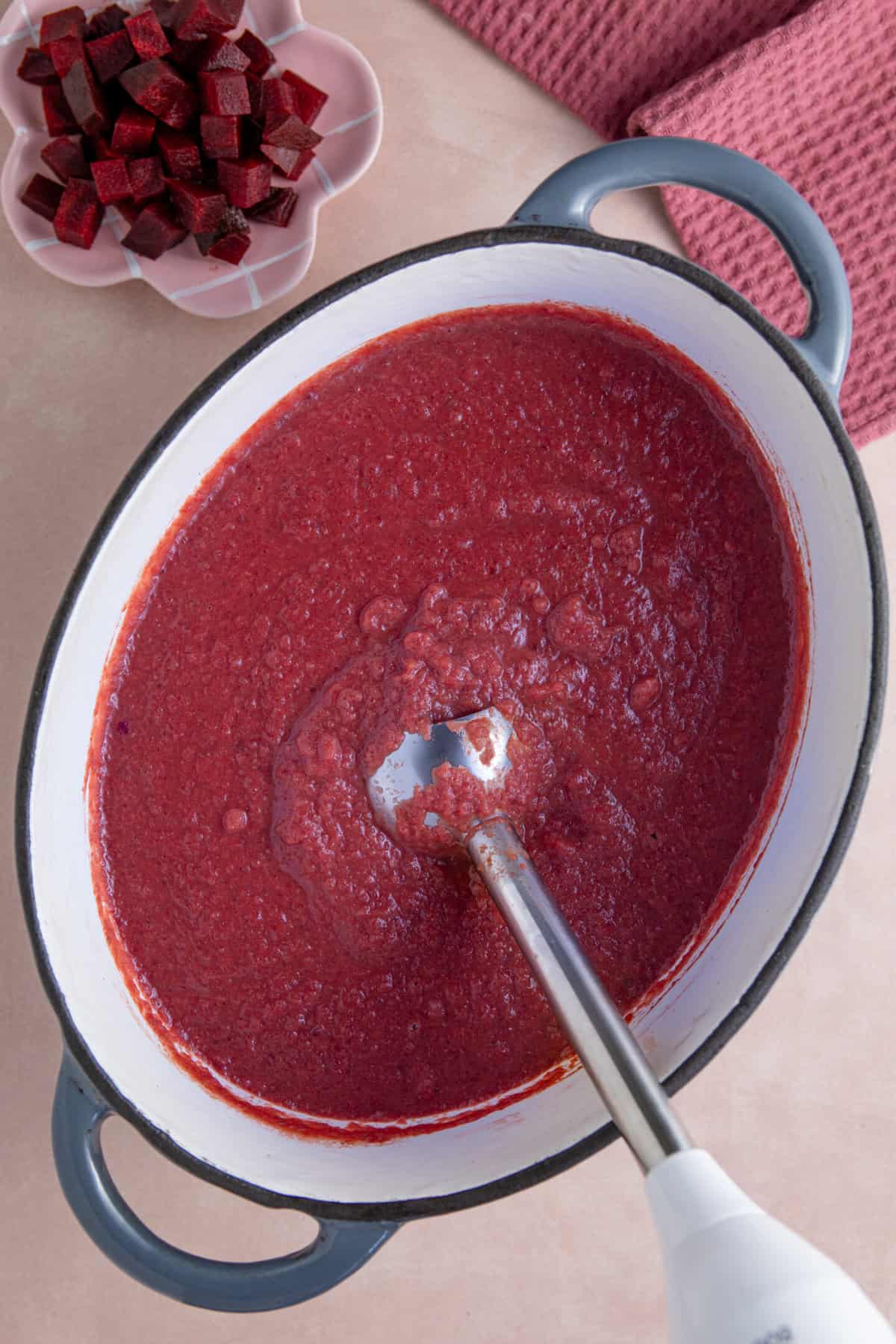 Blend the soup up to form a vibrant, beetroot soup.